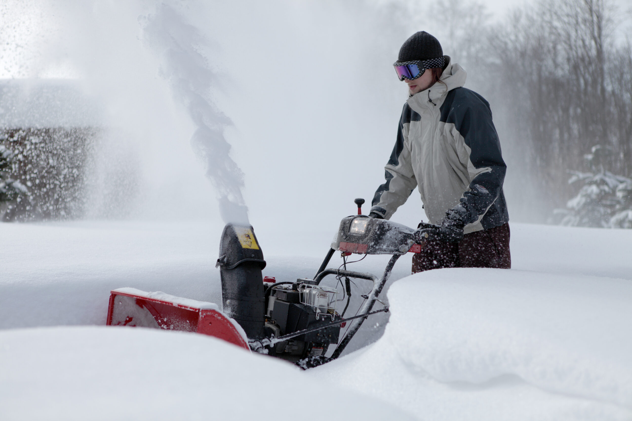 snow blowing man